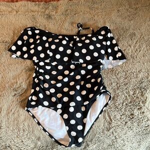 Black and white polkadot, one piece swimming suit